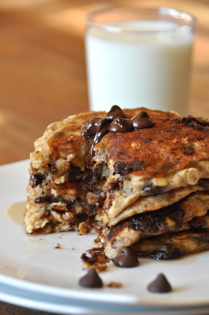Stack of Chocolate Chip Oatmeal Pancakes and almond milk for an incredible vegan breakfast
