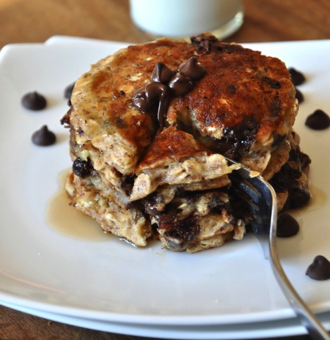 Using a fork to grab a big bite of our delicious Chocolate Chip Oatmeal Pancakes