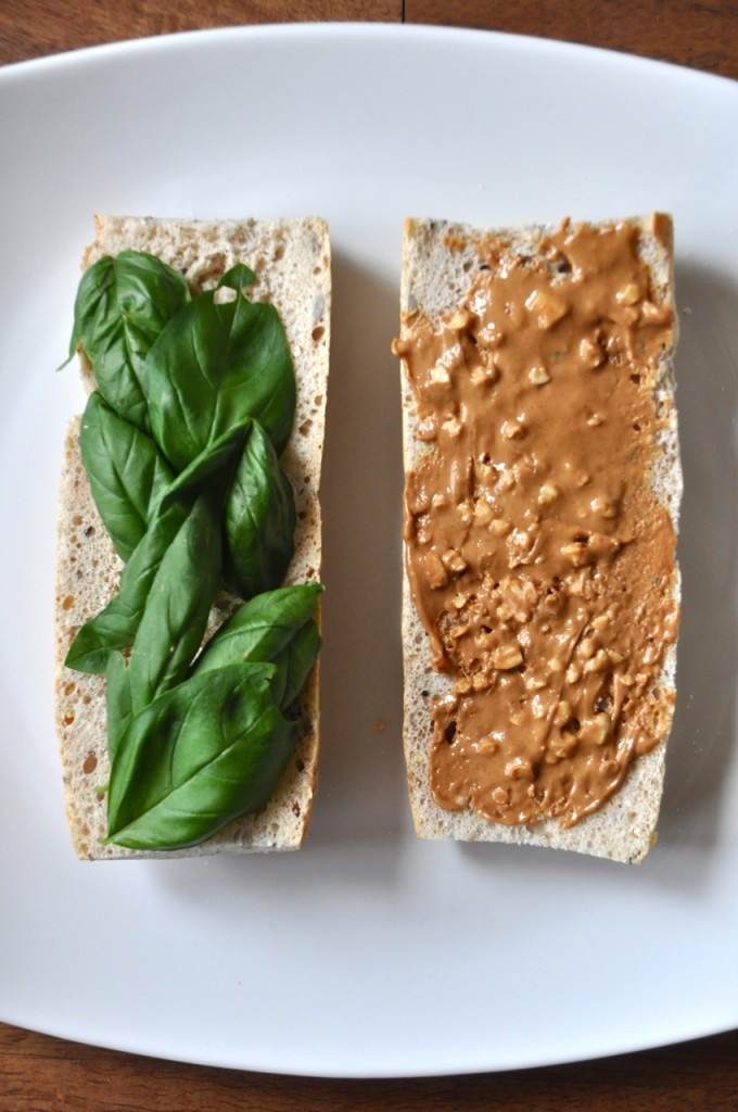 peanut butter basil sandwich4 Slices of bread topped with fresh basil and peanut butter for making a healthy vegan sandwich