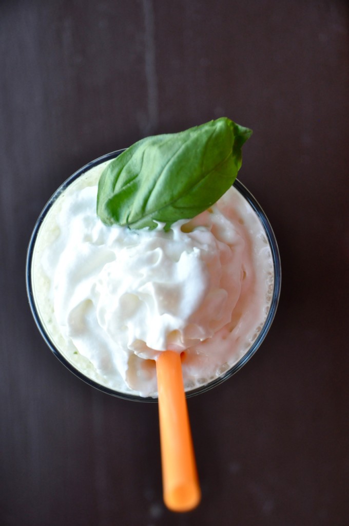 peanut butter basil milkshake 1 Top down shot of a Peanut Butter and Basil Milkshake topped with whipped cream