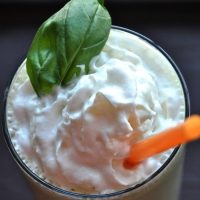 Top down shot of a glass filled with our Peanut Butter and Basil Milkshake recipe