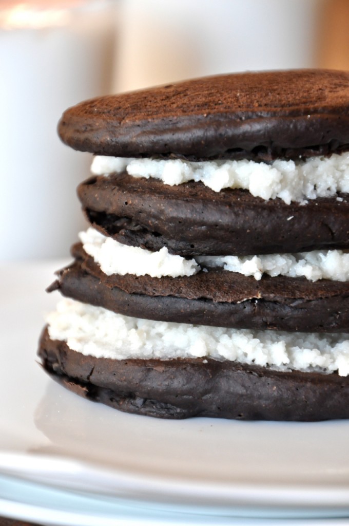 vegan oreo pancakes!! Plate with layers of Chocolate Pancakes and coconut butter for Oreo Cookie Pancakes