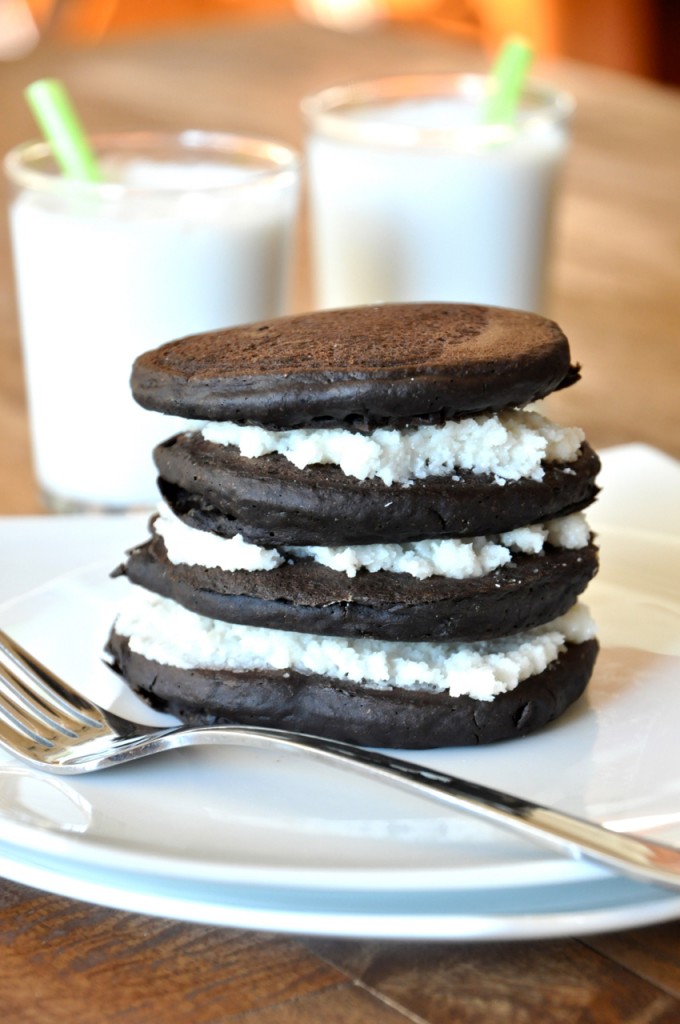 vegan oreo pancakes Stack of our Oreo Cookie Pancakes recipe alongside glasses of almond milk