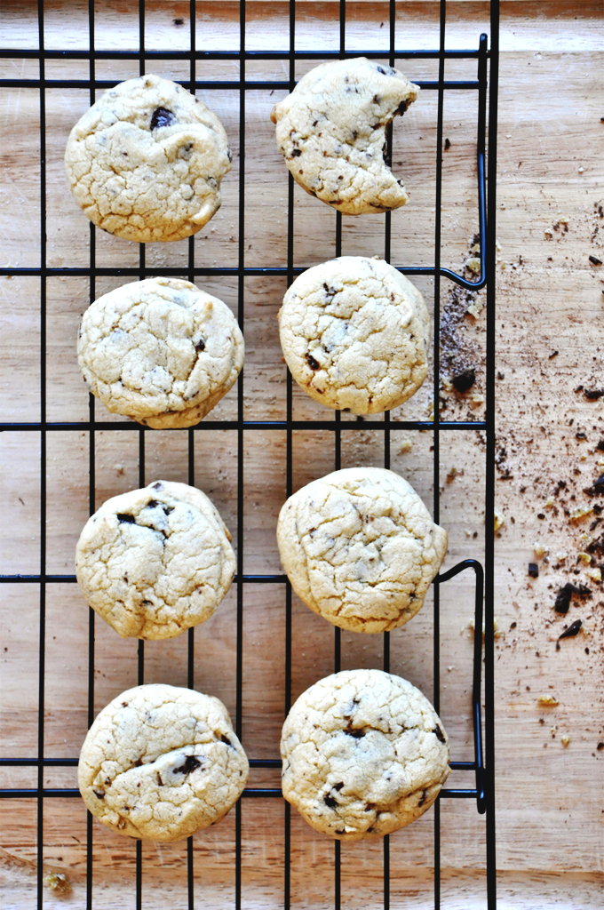 Candied Ginger Chocolate Chip Cookies! Batch of Candied Ginger & Sea Salt Chocolate Chip Cookies resting on a cooling rack