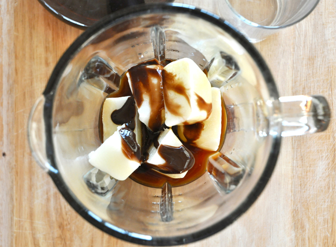 Blender with ingredients for making a homemade Cold Brew Mocha Frappe
