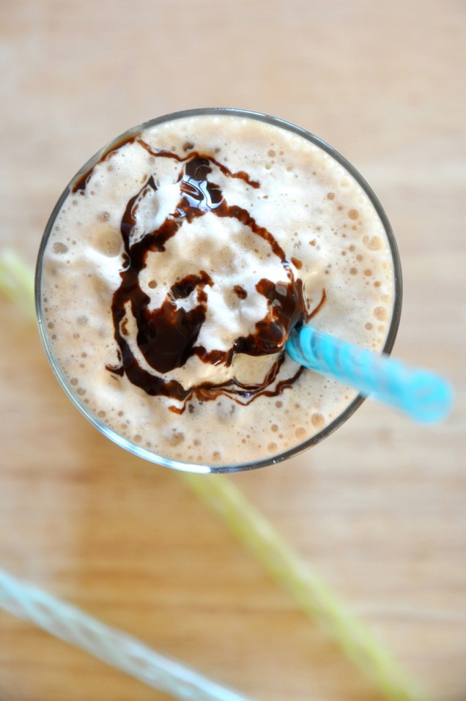 Top down shot of a Cold Brew Mocha Frappe topped with whipped cream and chocolate sauce