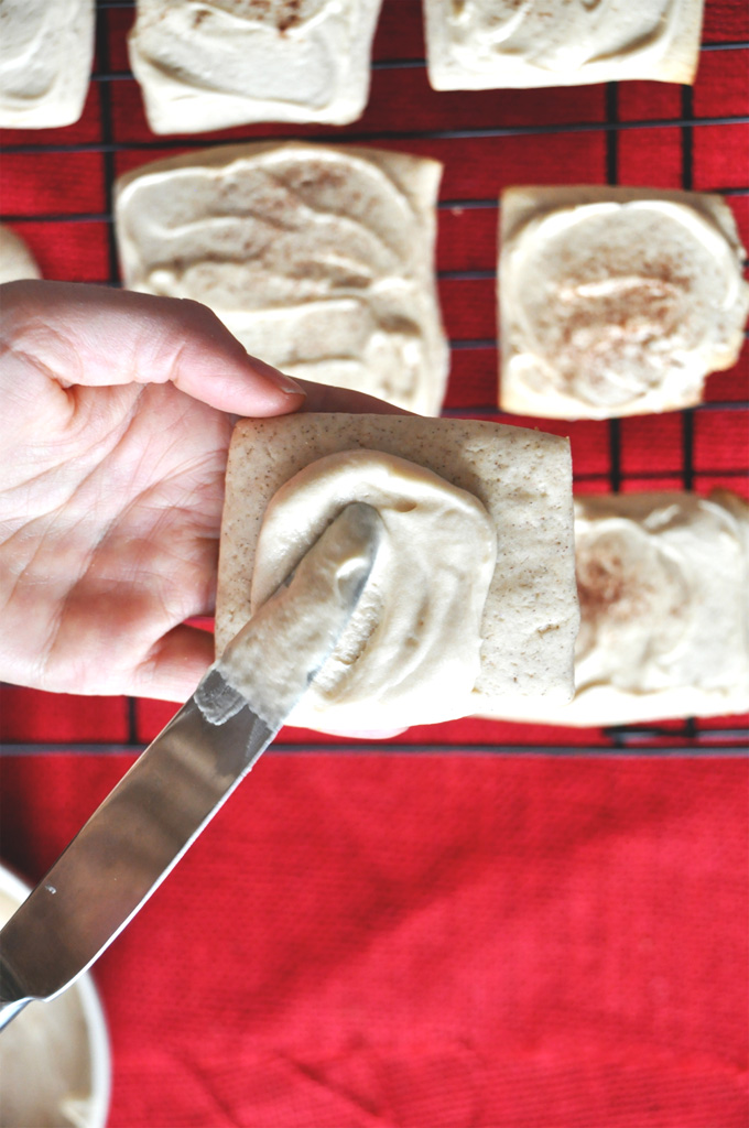 French Toast Cookies Minimalist Baker Spreading frosting onto a French Toast Sugar Cookie