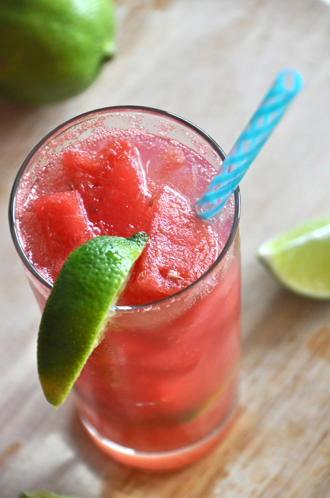 Grown Up Watermelon Limeades Close up shot of a Watermelon Limeade Cocktail with frozen watermelon chunks in it