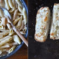 Pan of Light Alfredo Pasta and baking sheet of Cheesy Garlic Bread