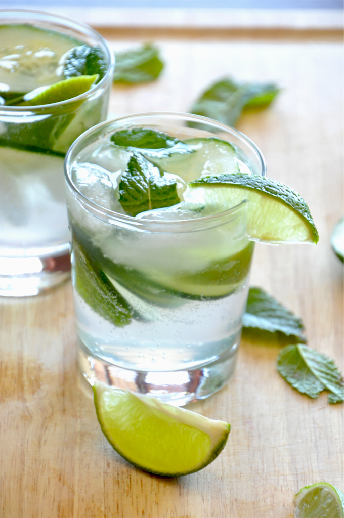 Cucumber Cocktail - Minimalist Baker Cucumber Cooler Cocktails sitting on a cutting board ready for a festive summer evening