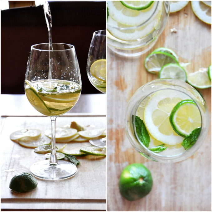 Pouring white wine into a glass for our Mint and Citrus White Wine Sangria recipe