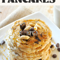 Stack of vegan snickers pancakes topped with chocolate and peanuts with text above them that says ready in 25 minutes