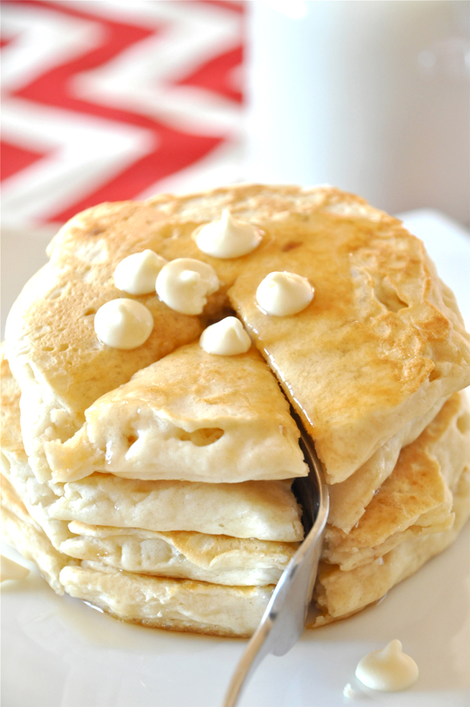 Minimalist Baker White Chocolate Macadamia Pancakes! Grabbing a bite from a batch of our White Chocolate Macadamia Nut Pancakes recipe