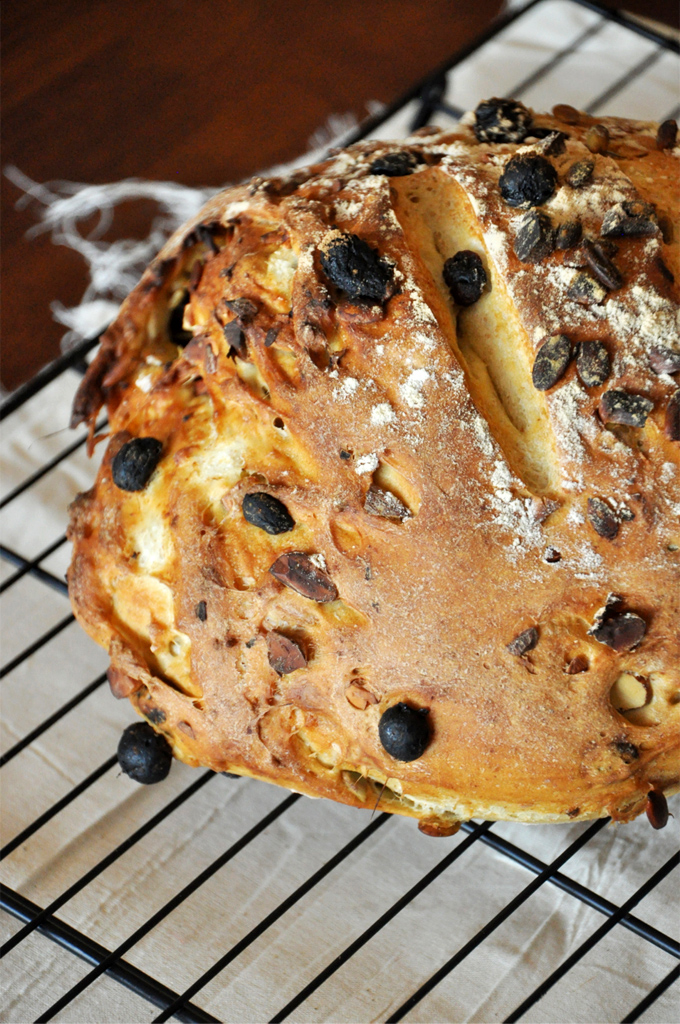 Muesli Bread! Minimalist Baker Close up shot of a freshly baked loaf of our Muesli Bread recipe resting on a cooling rack