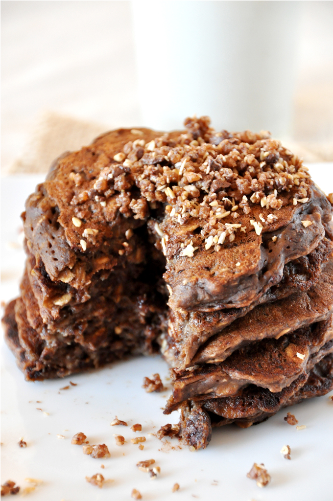 No Bake Cookie Pancakes by Minimalist Baker! Stack of No-Bake Cookie Pancakes with a slice removed