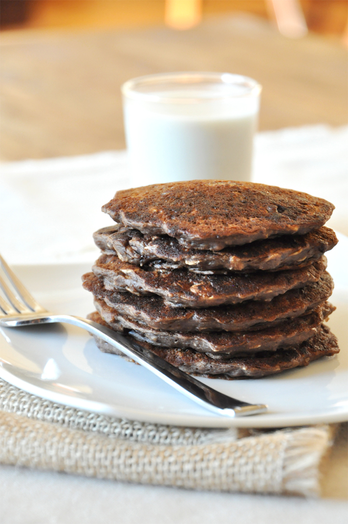 No Bake Cookie Pancakes!!! Stack of No-Bake Cookie Pancakes alongside a glass of soy milk