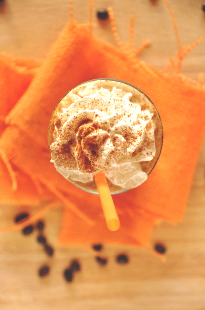 Pumpkin Frappuccino! | Minimalist Baker Top down shot of a glass of Pumpkin Frappuccino topped with whipped cream and cinnamon