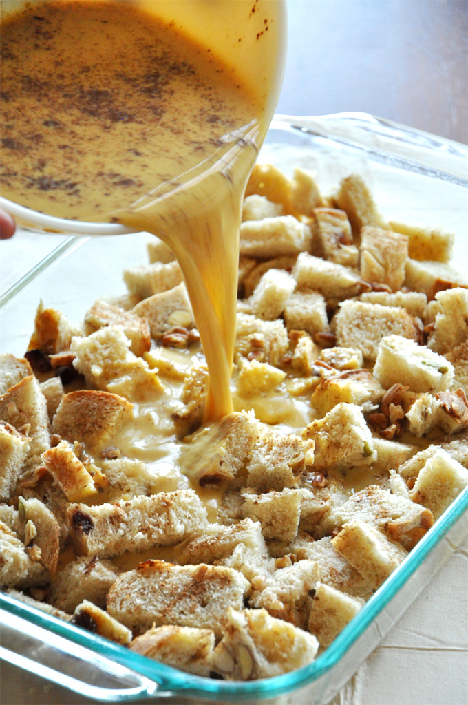 Pumpkin french toast! the pour Pouring egg mixture onto a batch of our Pumpkin French Toast Bake recipe