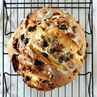Cooling rack with a loaf of simple homemade Muesli Bread