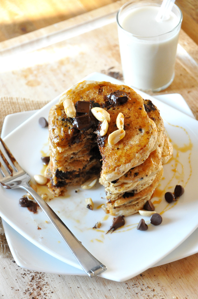 Stack of Vegan Snickers Pancakes with a slice removed