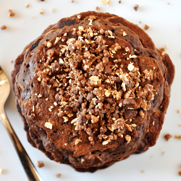 Top down shot of a stack of Vegan No-Bake Cookie Pancakes topped with granola