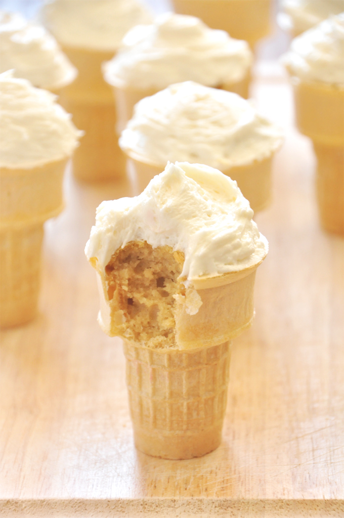 Bite taken from a Peach Cupcake with Honey Buttercream Frosting