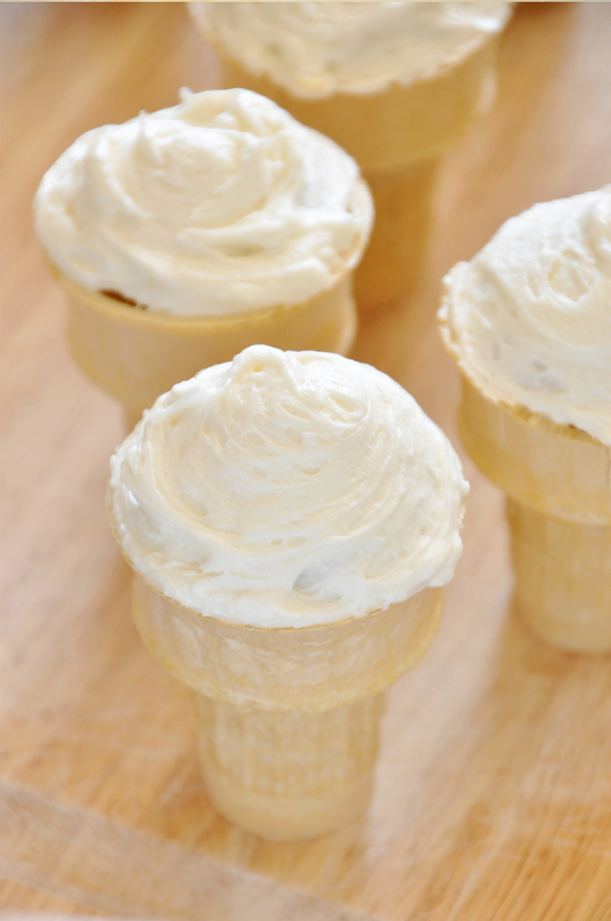 Close up shot of a Peach Cupcake decorated with Honey Buttercream Frosting