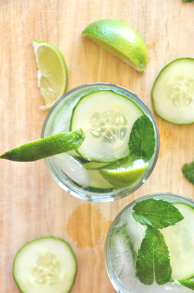 Top down shot of a refreshing Cucumber Cooler Cocktail with lime and mint