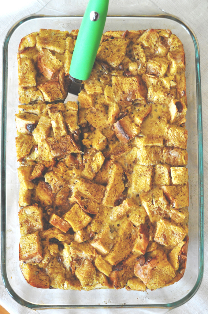 pumpkin french toast! - minimalist baker! Using a spatula to grab a slice from the pan of our Pumpkin French Toast Bake