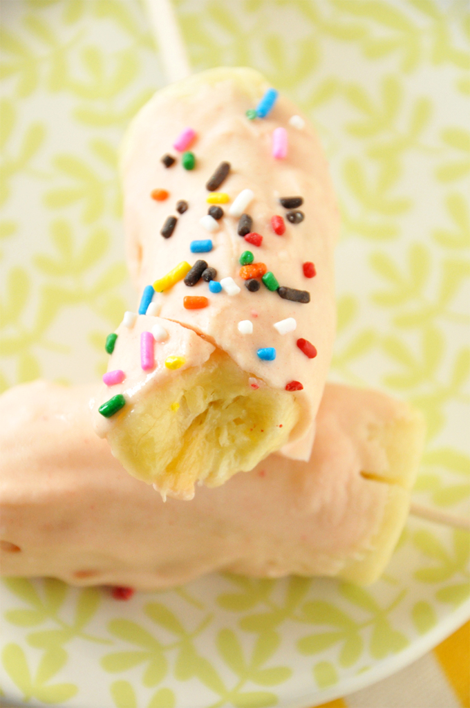 strawberry cake magic shell!! Banana pops coated in Strawberry Cake Magic Shell and rainbow sprinkles