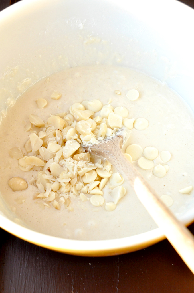 white chocolate chip macadamia nut pancakes Pancake batter with white chocolate chips and chopped macadamia nuts in it