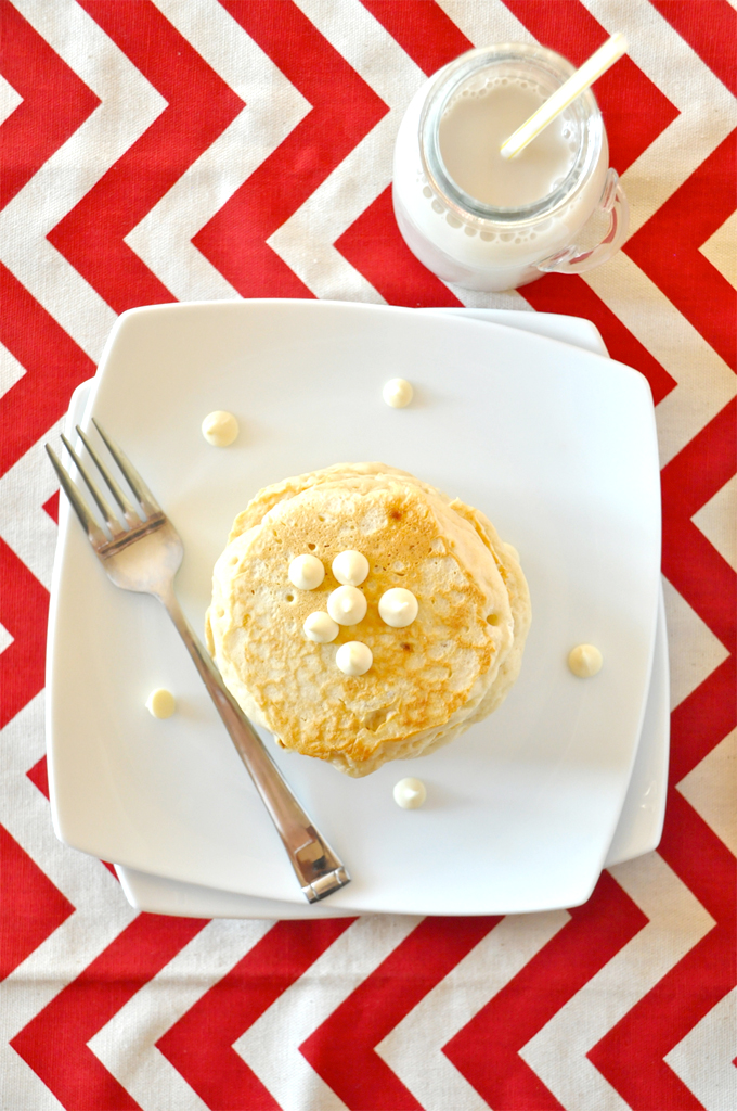 white chocolate macadamia cookie pancakes! Plate of White Chocolate Macadamia Nut Pancakes and a glass of soy milk
