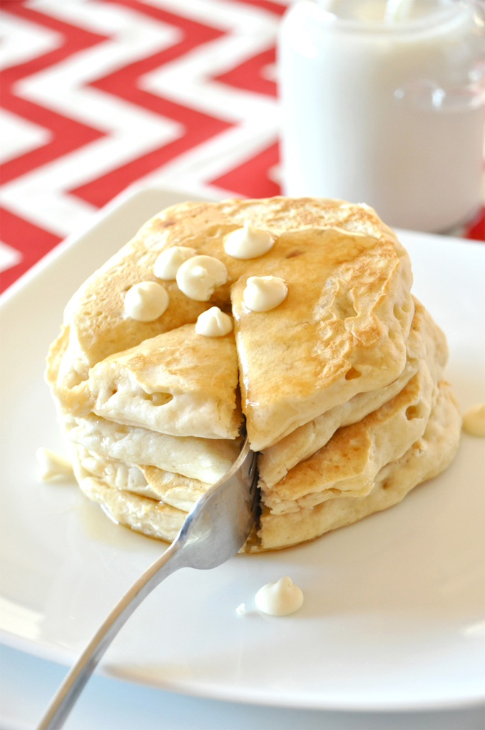 white chocolate macadamia nut pancakes! by minimalist baker Grabbing a bite of our delicious White Chocolate Macadamia Nut Pancakes for breakfast