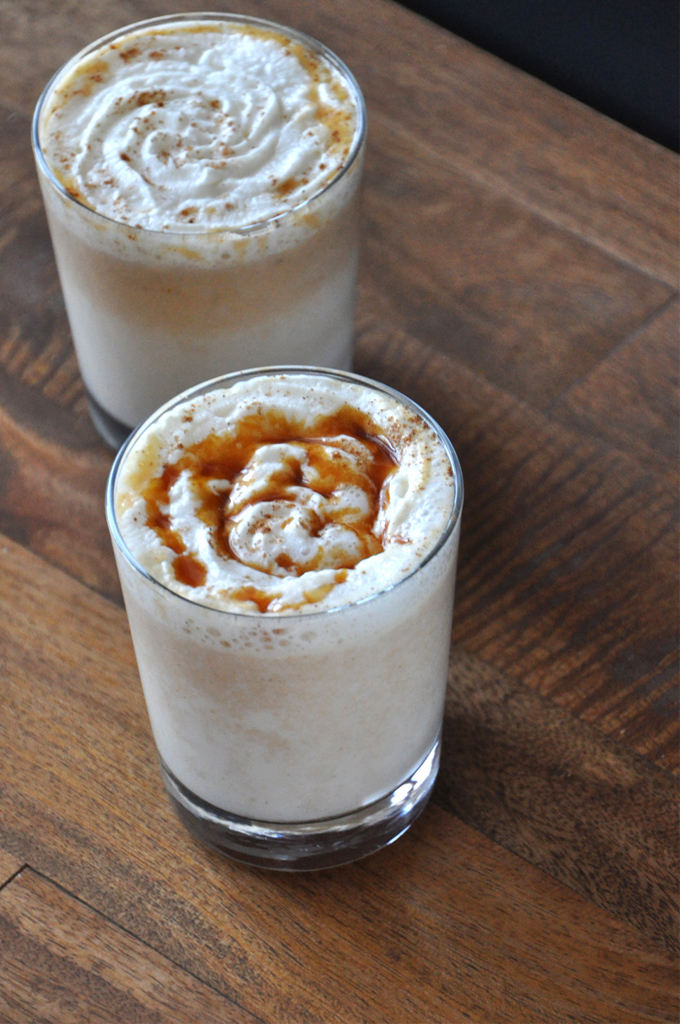 Boozy Pumpkin White Hot Chocolate 2 Ways! Glasses of Boozy Pumpkin White Hot Chocolate with one topped with caramel sauce