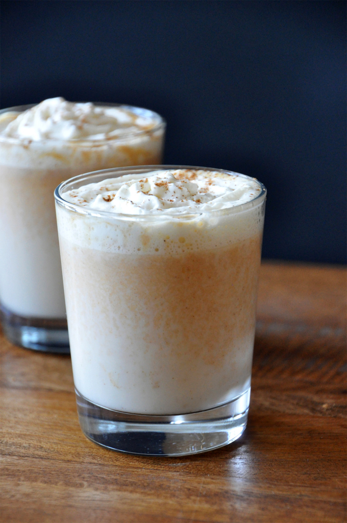 Boozy Pumpkin White Hot Chocolate 2 Ways Glasses of Boozy Pumpkin White Hot Chocolate topped with whipped cream