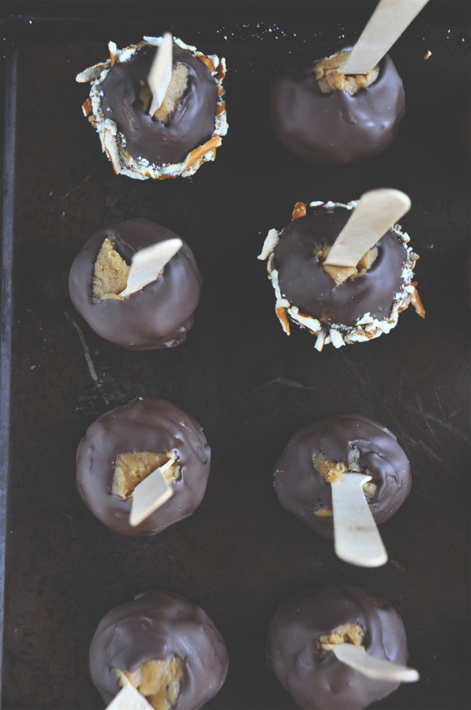 Pumpkin Chocolate Chip Cookie Dough Pops! Batch of Pumpkin Cookie Dough Pops covered in chocolate and nuts