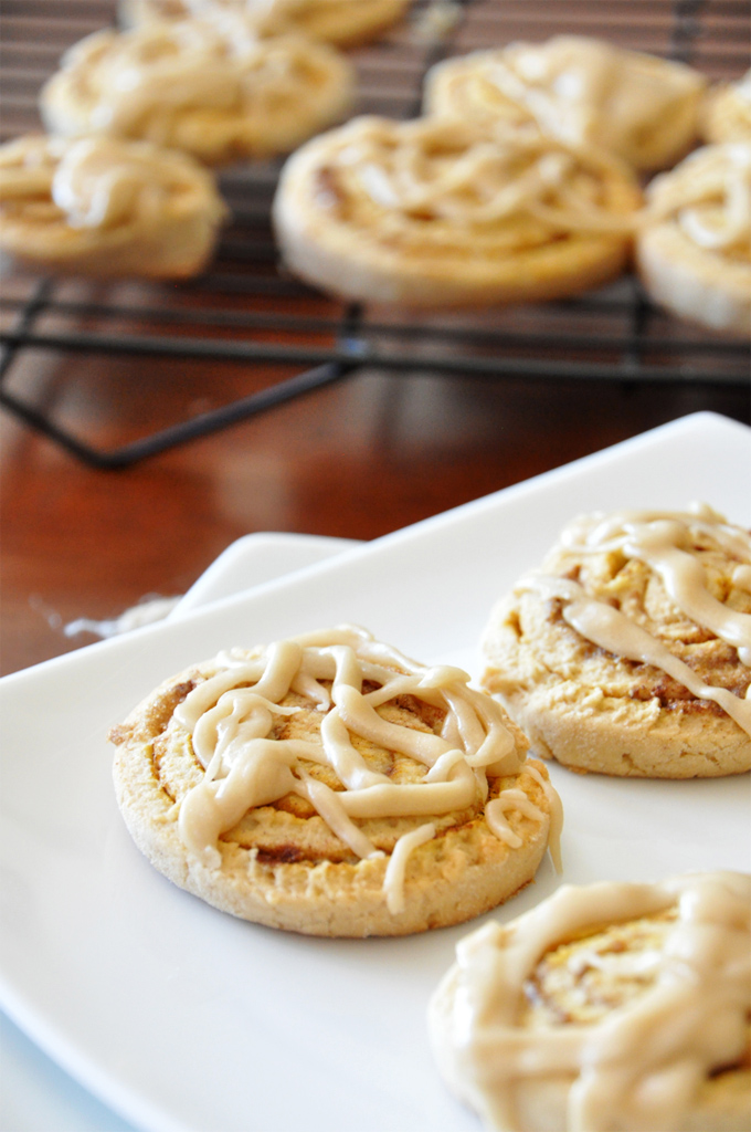 Plate and cooling rack with a batch of our Pumpkin Cinnamon Roll Cookies recipe