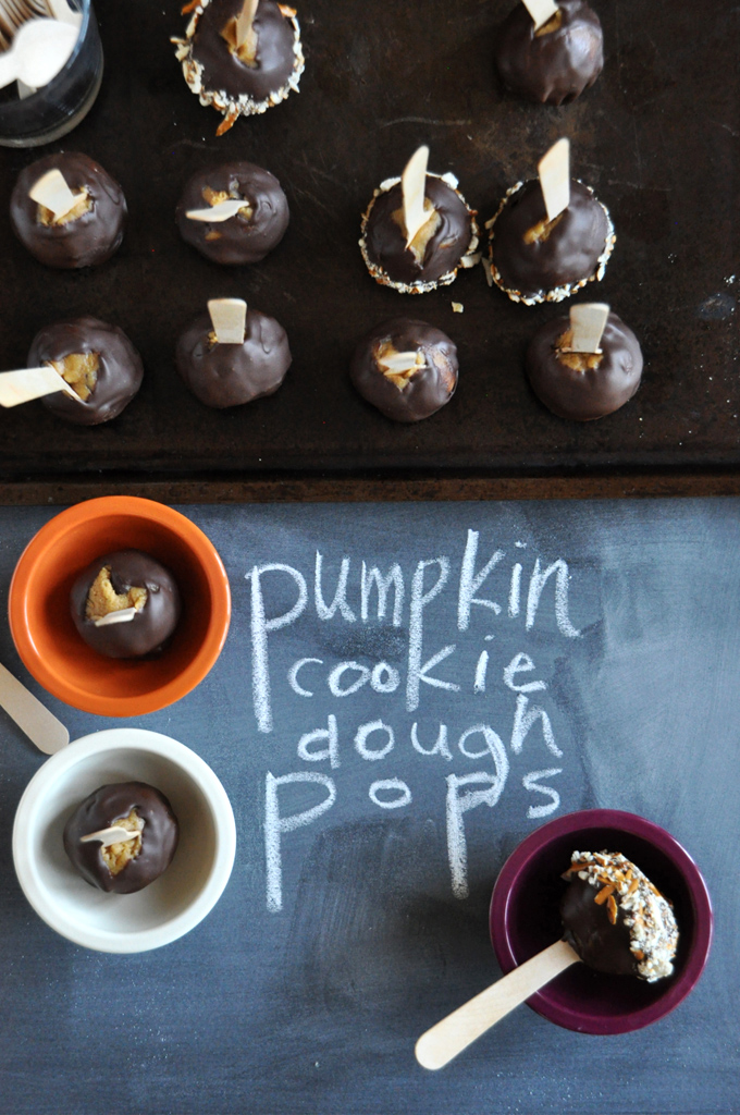 Pumpkin Cookie Dough Pops! Batch of our Pumpkin Cookie Dough Pops recipe on a baking sheet and in bowls