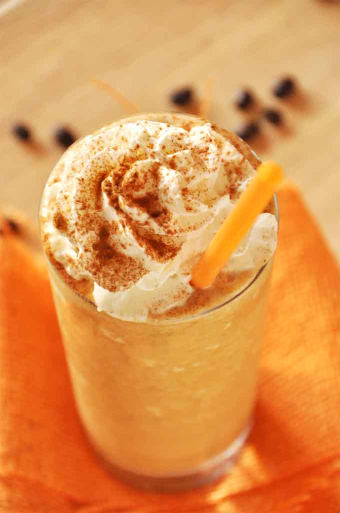 Tall glass of our homemade healthier Pumpkin Frappuccino recipe for a delicious treat