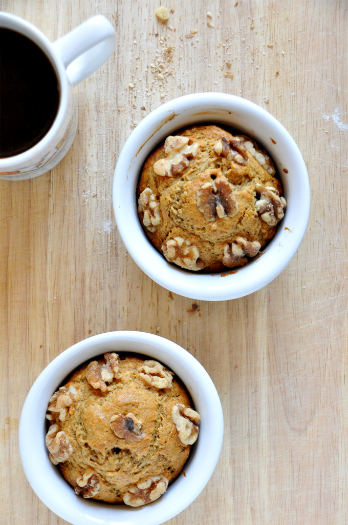 Vegan Banana Nut Muffins for 2 Cup of coffee alongside ramekins filled with our Vegan Banana Nut Muffins for 2 recipe