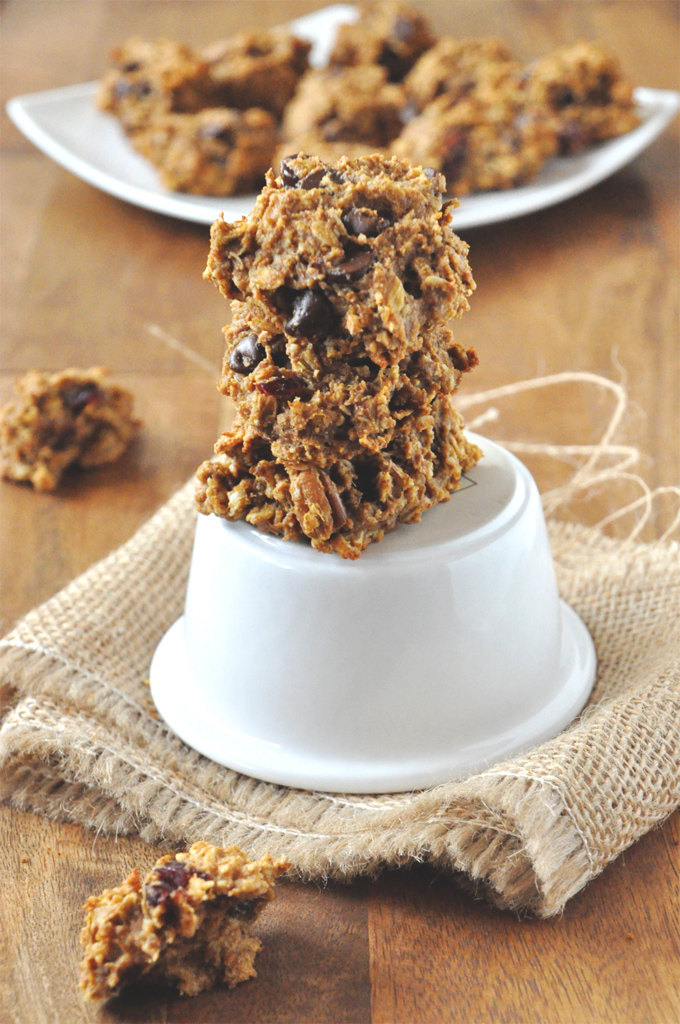 Stack of Vegan Everything Breakfast Cookies with a plate of cookies behind it