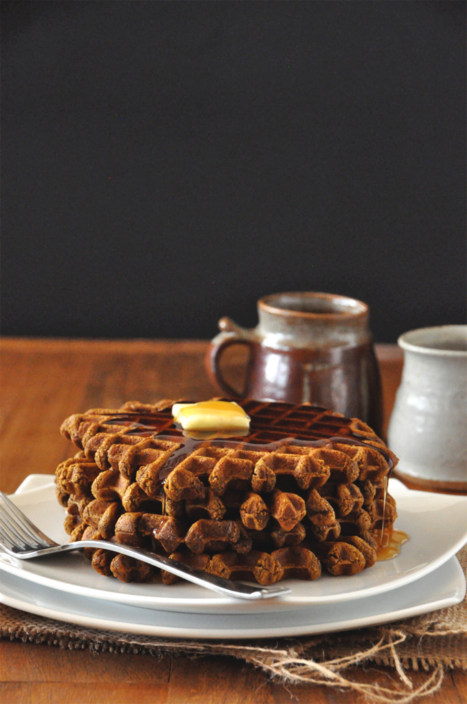 Vegan Gingerbread Waffles - MinimalistBaker.com Stack of a batch of our simple Vegan Gingerbread Waffles topped with syrup and butter