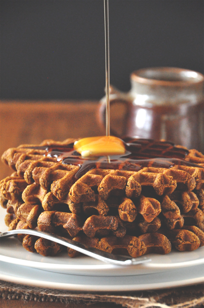 Vegan Gingerbread Waffles! Drizzling syrup onto a slab of vegan butter perched on top of delicious homemade Gingerbread Waffles