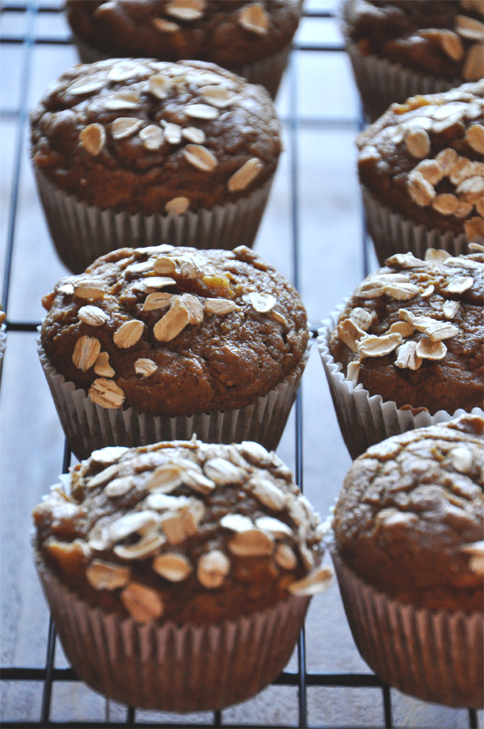 Cooling rack with a batch of Vegan Pumpkin Apple Muffins topped with oats