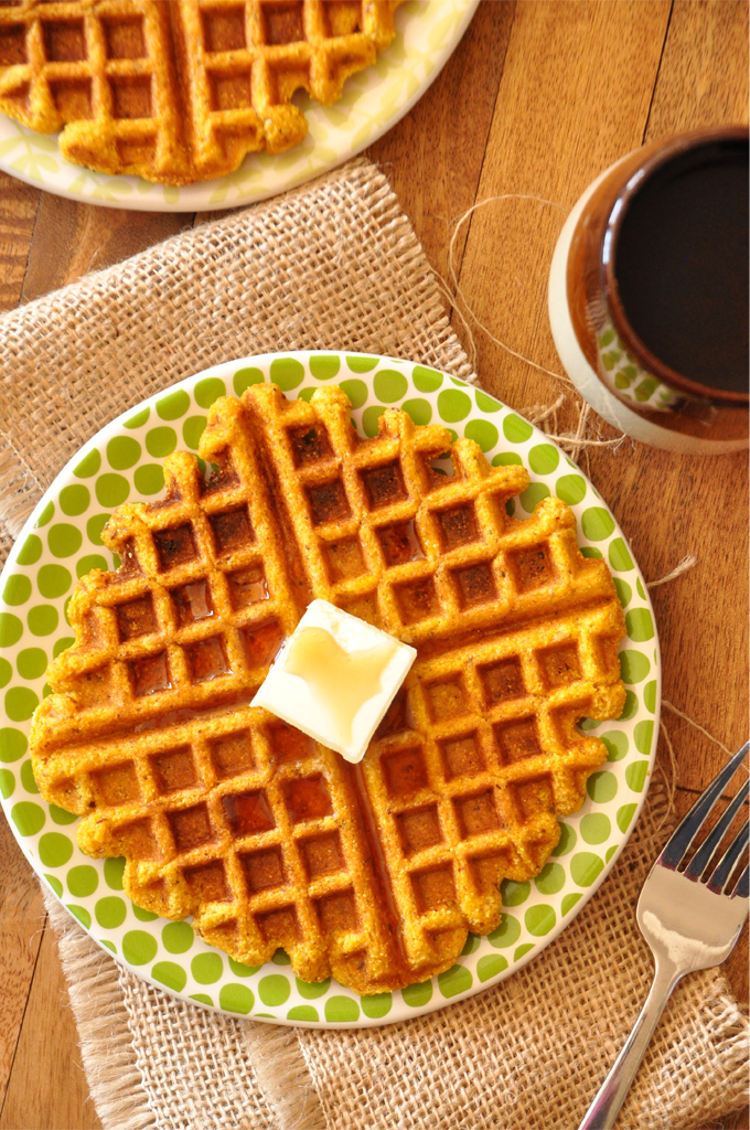 Plates of homemade Pumpkin Cornbread Waffles for a delicious vegan breakfast