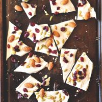Pieces of homemade Pumpkin Bark on a baking sheet