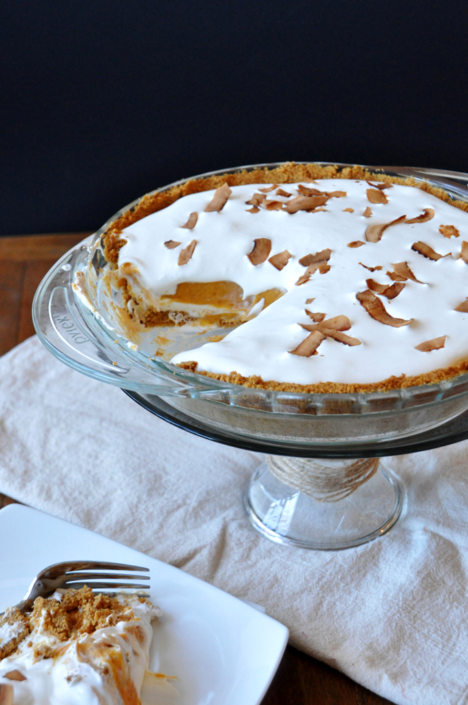 Creamy Pumpkin Pie perched on a cake stand for a delicious Thanksgiving dessert recipe