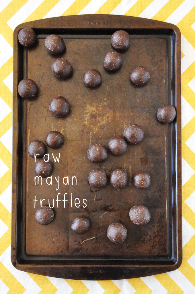 Raw Mayan Truffles | Minimalist Baker Cutting board filled with a batch of our Raw Mayan Truffles recipe