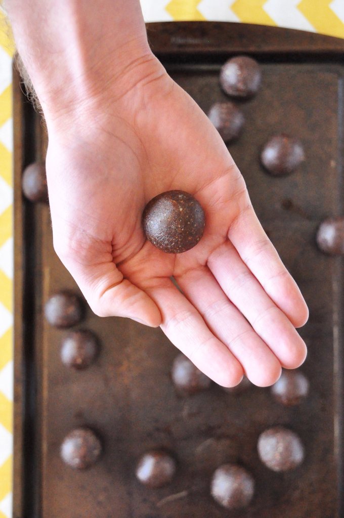 Raw Mayan Truffles Holding a homemade Vegan Truffle made with cinnamon and cayenne