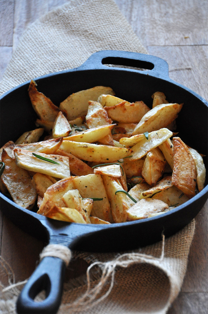 Rosemary Garlic Fries Batch of our Crispy Baked Rosemary Garlic Fries recipe in a cast-iron skillet